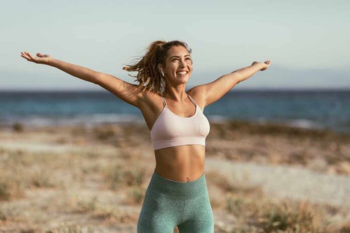 A,Smiling,Woman,Is,Doing,Relaxing,Stretching,Exercises,Before,Morning