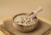 FDA-Approved Oats: The Cholesterol Slayer Revealed A wooden bowl filled with oats and a wooden scoop