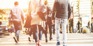 Group of pedestrians crossing a street in an urban setting