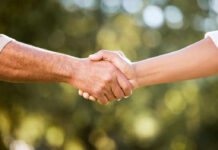 Two hands shaking in a gesture of agreement