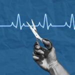 A hand holding scissors above a heartbeat line on a blue background