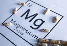 Magnesium Deficiency Risks Exposed Magnesium element symbol with colorful capsules arranged around it