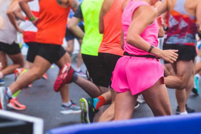 Marathon,Runners,Crowd,,Participants,Start,Running,The,Half-marathon,In,The Runners participating in a marathon, wearing colorful athletic gear
