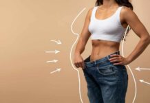 The Dark Side of Weight Loss! Woman showcasing weight loss by holding oversized jeans