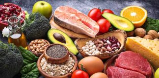 Assorted healthy foods arranged on a dark surface