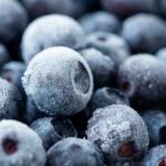 Close-up of frozen blueberries with a frosty texture