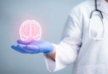Simple Habits, Wild Alzheimer’s Drop A medical professional holding a glowing digital brain illustration in their hand