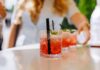 Beet Juice Hack Stuns Heart Docs Close-up of cocktails on a table with a person reaching for one