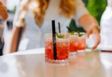 Beet Juice Hack Stuns Heart Docs Close-up of cocktails on a table with a person reaching for one