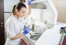 Gut Marker Linked To Falls, Frailty & How Well Women Age Lab technician using an analyzer with a pipette