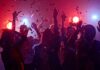 Concert Headbanging, Silent Brain Damage Group of people dancing under confetti and colorful lights