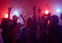 Concert Headbanging, Silent Brain Damage Group of people dancing under confetti and colorful lights
