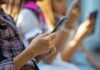 Hands of young people using smartphones