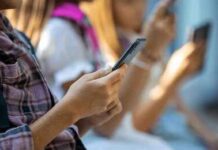 Hands of young people using smartphones