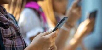 Hands of young people using smartphones