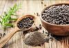 This Grain Helps Protect Your Brain As You Age Black peppercorns in a wooden bowl and spoon with ground pepper