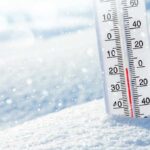 Hidden Danger of Cold Homes, For Senior Brains Thermometer in snow showing subzero temperature