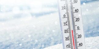 Thermometer in snow showing subzero temperature