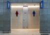 Public restroom entrance with male and female symbols