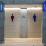 Public restroom entrance with male and female symbols