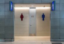 Public restroom entrance with male and female symbols