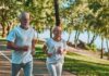 Older couple jogging on a lakeside path