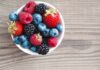 Eat Red, Beat Deadly Heart Trouble Bowl of mixed berries on wooden table