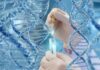 Gloved hands pipetting liquid into a test tube amid DNA helix graphics