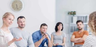 Support group meeting with six adults seated in a circle
