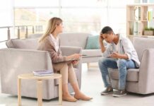 Hidden Depression Masquerades As Anger Teen talking with therapist in a bright office