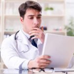 The Health Trends Scientists are Worried About Doctor reviewing a file at a desk