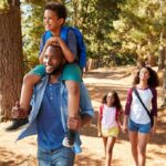 family hiking on a forest trail