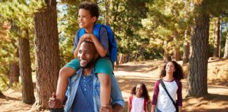 family hiking on a forest trail