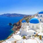 Longevity Island Defies Anti‑Aging Industry Scenic view of Santorini with blue domed buildings overlooking the Mediterranean Sea