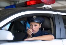 Police Alert: New high-tech car theft trend Police officer in patrol car using radio