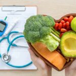 Tools for Hormone Optimization in Males Heart-shaped bowl of healthy foods with medical tools