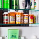 Why Vitamin B12 Absorption Becomes A Problem After 50 Medicine cabinet with prescription bottles and toiletries