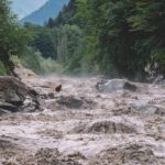 Nightmare Wall Of Water Hits Nepal Flooded river gorge with fast muddy water and rocks