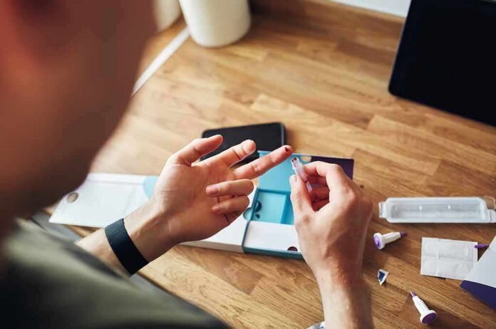 Person using a finger-prick lancet for a home test kit