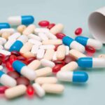 New Pill Rivals Ozempic With 16% Weight Loss Assorted pills and capsules spilled from a bottle