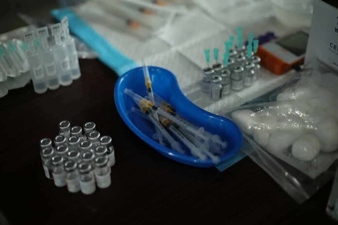 Medical syringes and vials arranged on a table