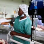 Houston Alarm: Dialysis Cases Defy Logic IV drip and blood pressure gauge in a hospital ward