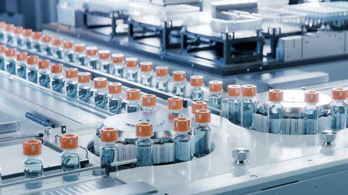 shutterstock_2422913535 Pharmaceutical vials on an automated production line