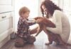 The Pet Bond Trap Exposed toddler petting orange cat held by woman on kitchen floor
