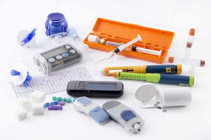 shutterstock_268712894-1 Diabetes management tools and supplies on a white surface