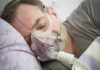 Sleep Machine’s Surprising Mood Boost Man sleeping with a CPAP mask on his face