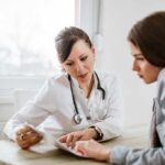 FDA Greenlights Needle-Killer Cholesterol Pill Doctor consulting a patient at a desk
