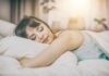 Woman sleeping on a bed