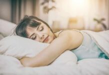 Pink Noise and Sleep Woman sleeping on a bed