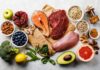5 Everyday Nutrients Linked To Lower Heart Risk Assorted healthy foods with salmon, beef, chicken, fruits, vegetables, nuts, and grains